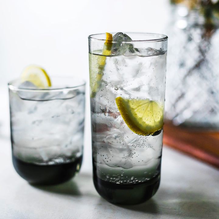 Polished multi-purpose smoke-colored glasses set ideal for serving gin and tonics and old fashioned cocktails includes eight 16.25-ounce drinking glasses and eight 12.25-ounce rocks glasses