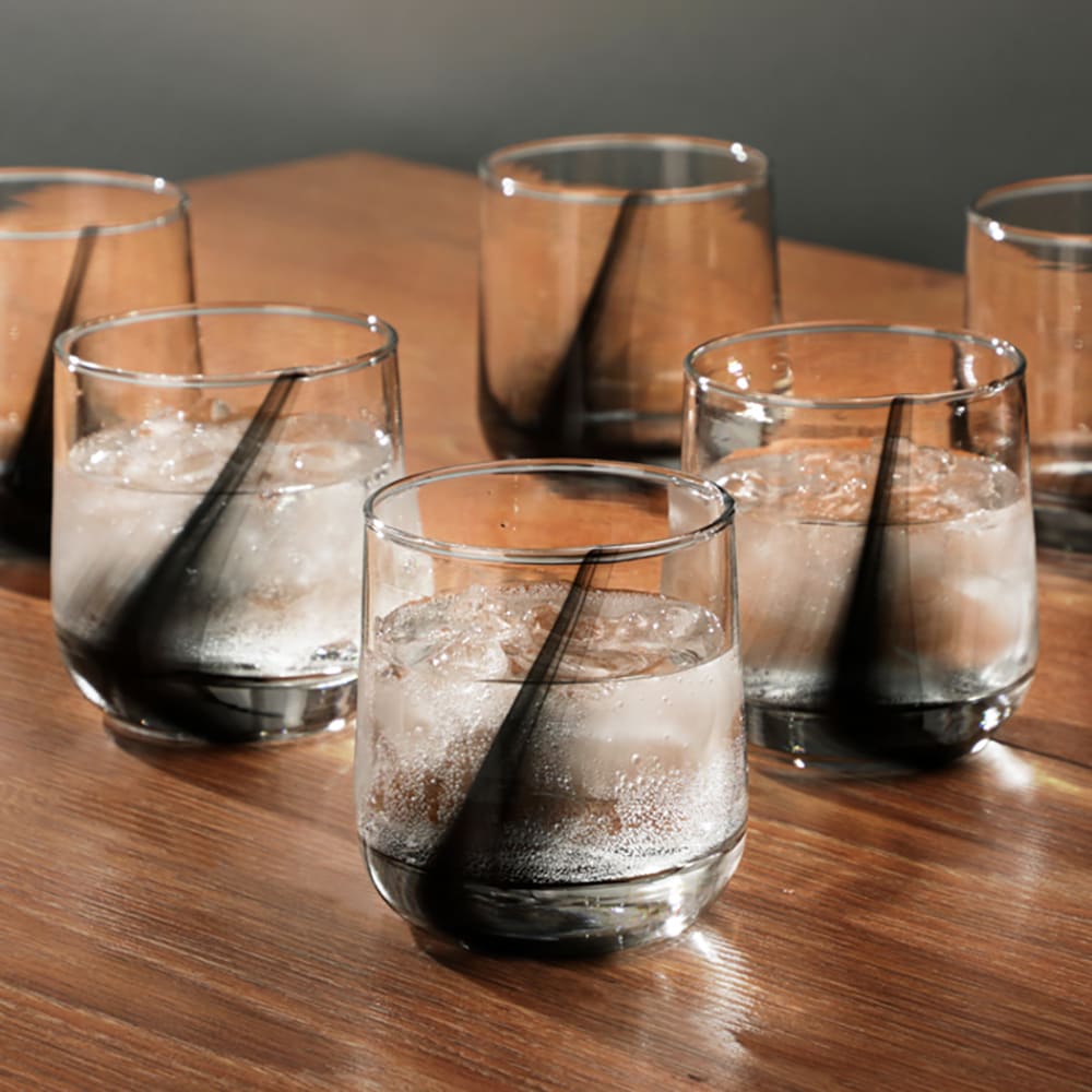 Each glass features a flowing black swirl accent embedded within clear glass for a refined, modern aesthetic.